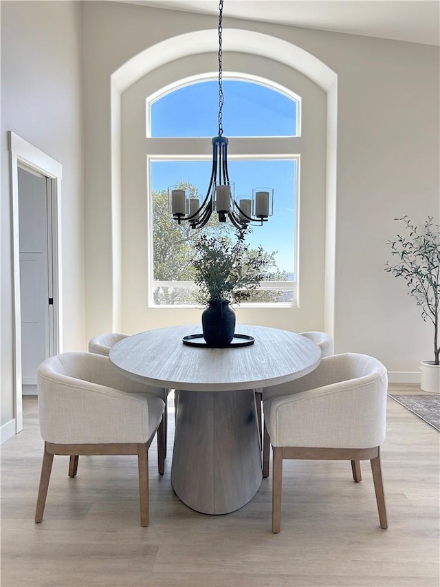 12460 San Marcos Rd, Atascadero, CA 93422 - dining space featuring a chandelier, light wood-style floors, and plenty of natural light