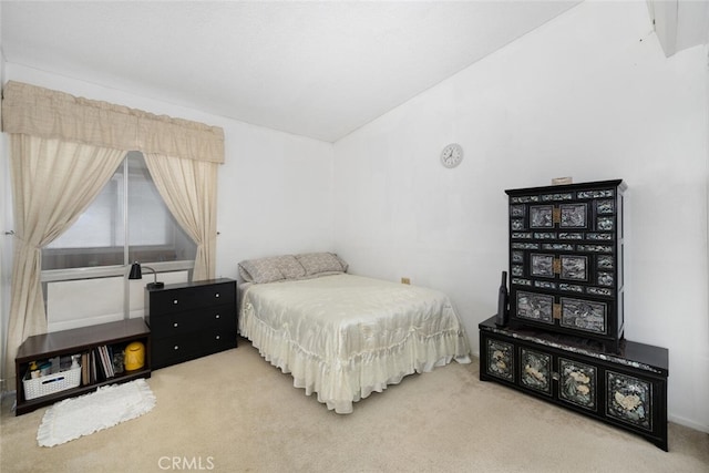 bedroom featuring carpet flooring and vaulted ceiling