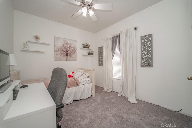 office with carpet floors and a ceiling fan