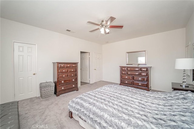 carpeted bedroom featuring a ceiling fan