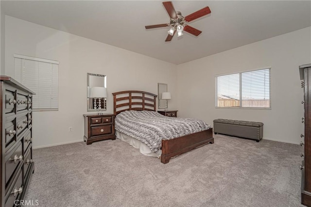 carpeted bedroom featuring baseboards