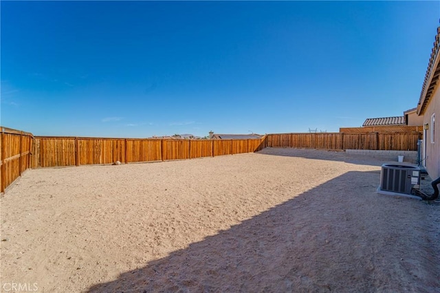 fenced backyard with central AC unit