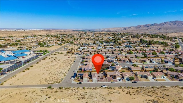 drone / aerial view of a mountainous background and a desert landscape