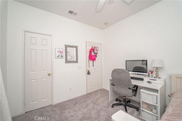 carpeted office featuring a ceiling fan