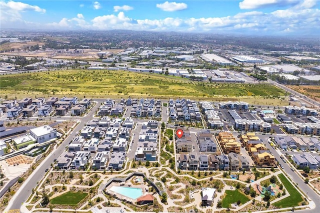 aerial view of property and surrounding area with nearby suburban area