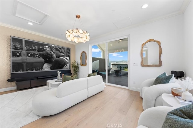 living room featuring attic access, crown molding, wood finished floors, recessed lighting, and baseboards