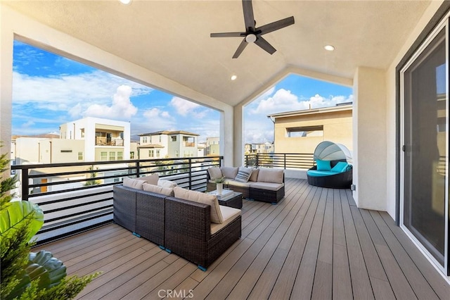 deck with an outdoor living space, ceiling fan, and a residential view