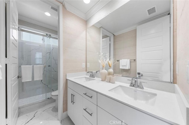 full bathroom with crown molding, a marble finish shower, toilet, double vanity, and marble finish floors