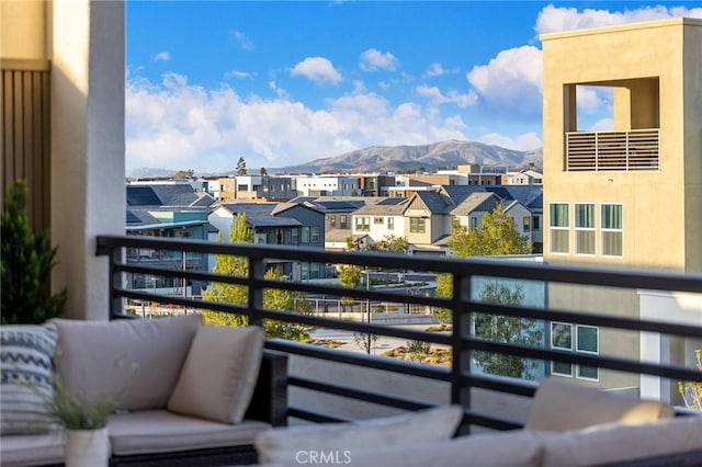balcony featuring a mountain view and a residential view