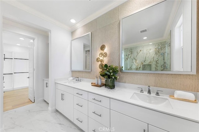 full bathroom featuring crown molding, marble finish floors, a marble finish shower, double vanity, and recessed lighting