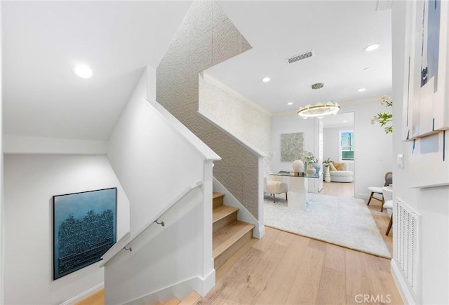 stairs featuring wood finished floors, recessed lighting, and baseboards