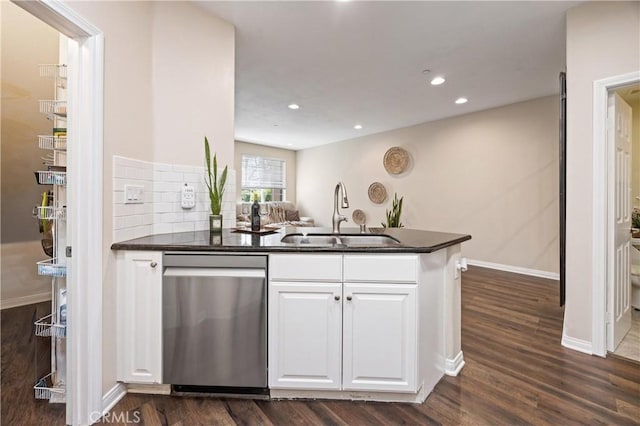 8029 Spencer St, Chino, CA 91708 - kitchen featuring stainless steel dishwasher, a sink, dark countertops, white cabinetry, and recessed lighting