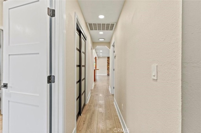 2681 Pinecrest Rd, Oroville, CA 95966 - hall with light wood finished floors, recessed lighting, a textured wall, and baseboards