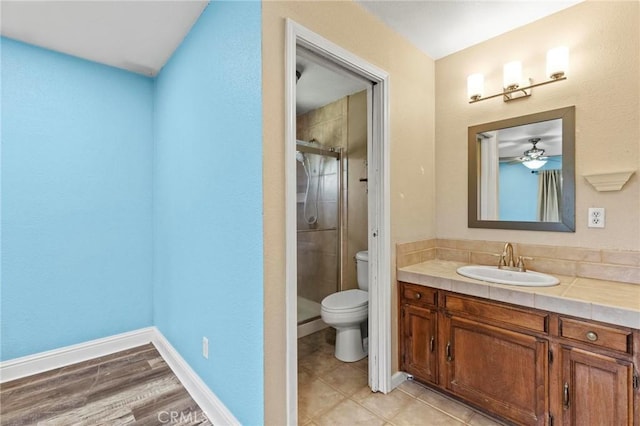 2681 Pinecrest Rd, Oroville, CA 95966 - bathroom featuring toilet, a stall shower, vanity, and a ceiling fan