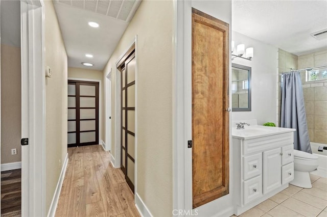 2681 Pinecrest Rd, Oroville, CA 95966 - hallway featuring a sink, light wood-style flooring, and baseboards