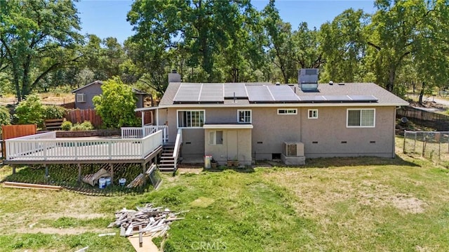 2681 Pinecrest Rd, Oroville, CA 95966 - back of house with a deck, a chimney, roof mounted solar panels, and central AC unit