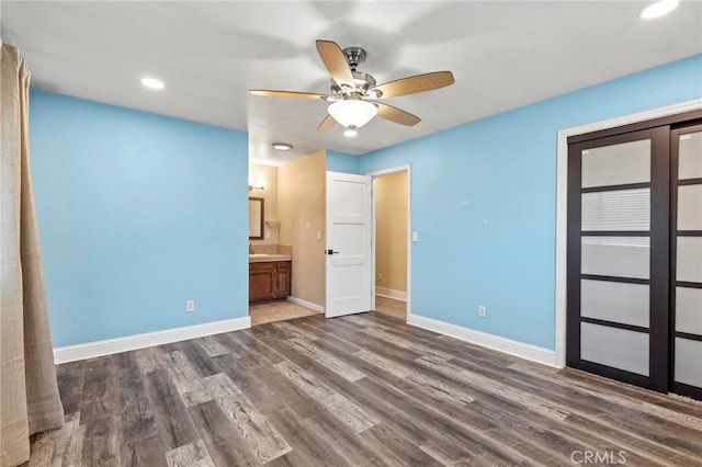2681 Pinecrest Rd, Oroville, CA 95966 - unfurnished bedroom with baseboards, wood finished floors, ensuite bath, recessed lighting, and ceiling fan
