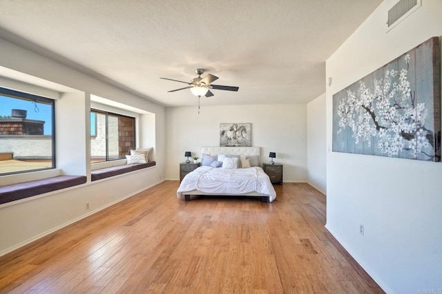 13063 Caminito Del Rocio, Del Mar, CA 92014 - bedroom with light wood finished floors and a ceiling fan