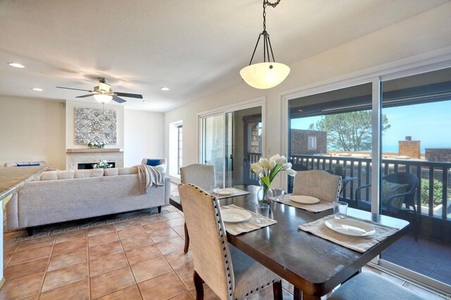 13063 Caminito Del Rocio, Del Mar, CA 92014 - dining room with ceiling fan, light tile patterned flooring, recessed lighting, and a fireplace
