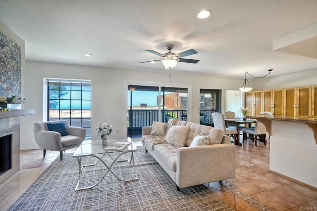 13063 Caminito Del Rocio, Del Mar, CA 92014 - living area featuring a ceiling fan, light tile patterned flooring, a high end fireplace, and recessed lighting