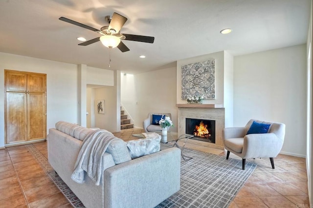 13063 Caminito Del Rocio, Del Mar, CA 92014 - living area with light tile patterned floors, stairs, a warm lit fireplace, a ceiling fan, and recessed lighting