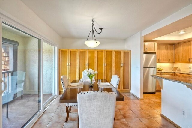 13063 Caminito Del Rocio, Del Mar, CA 92014 - dining area with light tile patterned flooring and baseboards