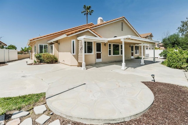 30602 Colina Verde St, Temecula, CA 92592 - rear view of property featuring a fenced backyard, a tiled roof, stucco siding, and a chimney
