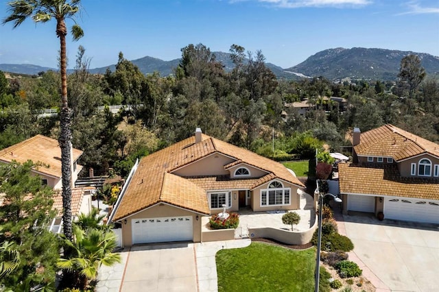 30602 Colina Verde St, Temecula, CA 92592 - view of front of home with driveway, a tiled roof, stucco siding, and a mountain view