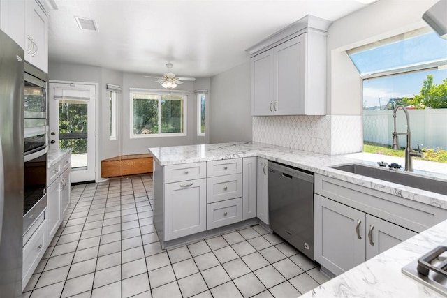 30602 Colina Verde St, Temecula, CA 92592 - kitchen featuring stainless steel dishwasher, a sink, healthy amount of natural light, and light tile patterned flooring
