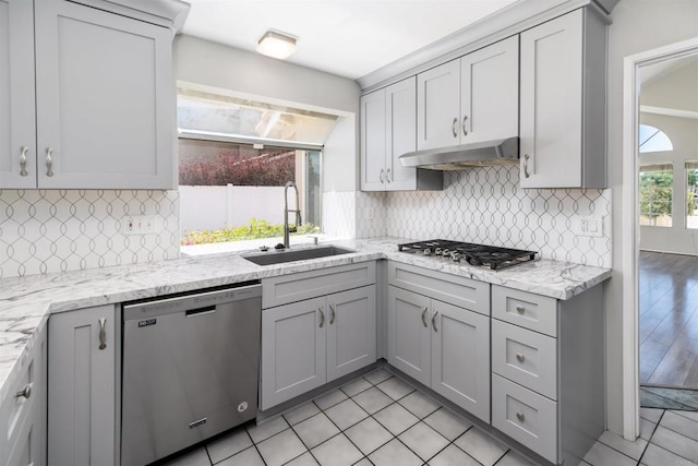 30602 Colina Verde St, Temecula, CA 92592 - kitchen with stainless steel appliances, a sink, under cabinet range hood, and gray cabinetry