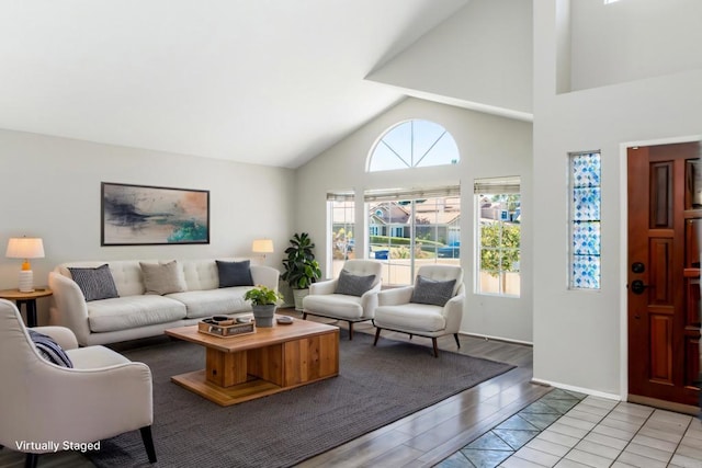30602 Colina Verde St, Temecula, CA 92592 - living room with light wood-type flooring, high vaulted ceiling, and baseboards
