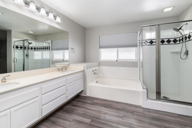 30602 Colina Verde St, Temecula, CA 92592 - bathroom with a stall shower, a bath, double vanity, and wood finished floors