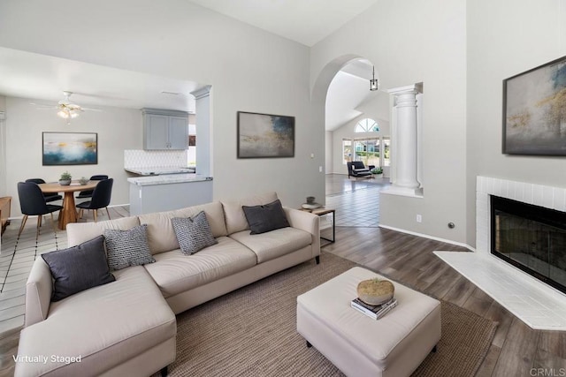 30602 Colina Verde St, Temecula, CA 92592 - living room with ornate columns, arched walkways, a ceiling fan, lofted ceiling, and dark wood-type flooring