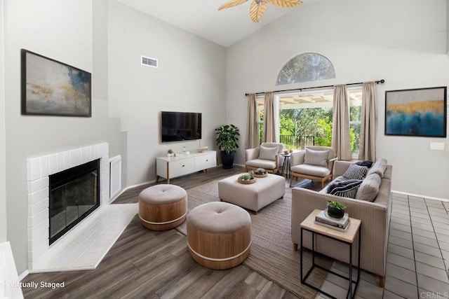 30602 Colina Verde St, Temecula, CA 92592 - living room featuring high vaulted ceiling, a brick fireplace, ceiling fan, wood finished floors, and baseboards
