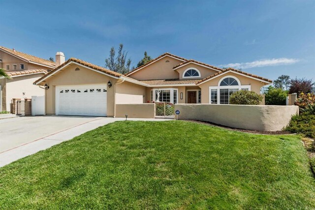 30602 Colina Verde St, Temecula, CA 92592 - mediterranean / spanish-style home with a fenced front yard, an attached garage, stucco siding, concrete driveway, and a tile roof