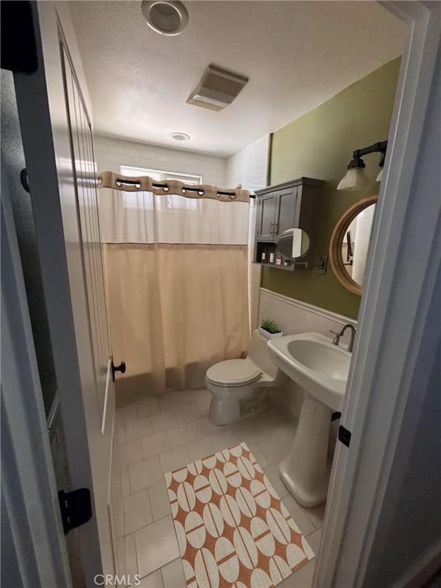 228 Del Mar Ave, Costa Mesa, CA 92627 - bathroom featuring tile patterned floors and shower / bathtub combination with curtain