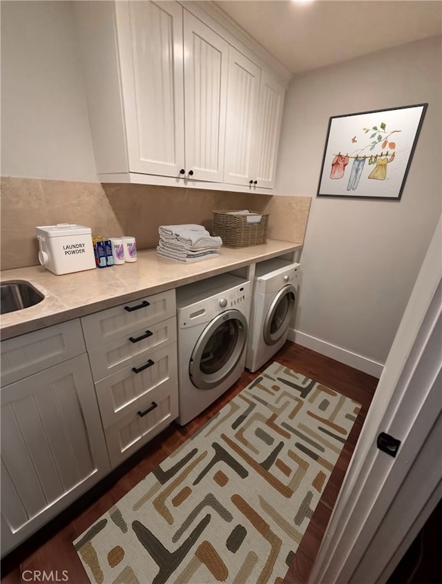 228 Del Mar Ave, Costa Mesa, CA 92627 - washroom featuring cabinet space, washing machine and clothes dryer, and dark wood-style floors