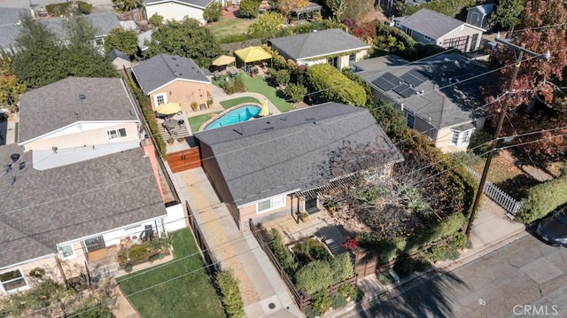 aerial view of residential area featuring a pool