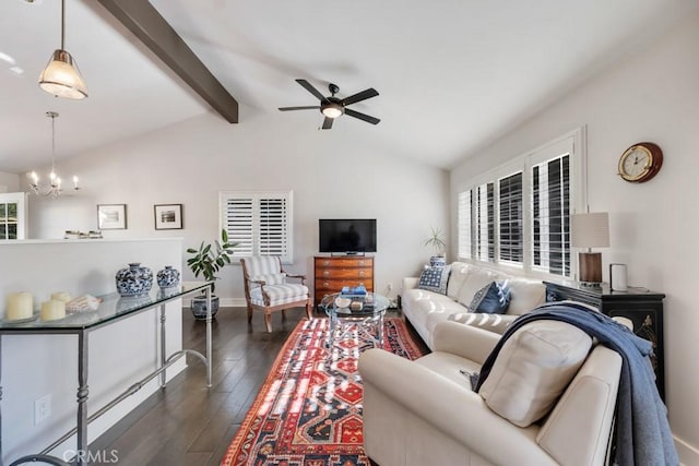 living area with ceiling fan, a chandelier, dark wood-style flooring, and baseboards