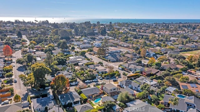 aerial view of property and surrounding area featuring nearby suburban area