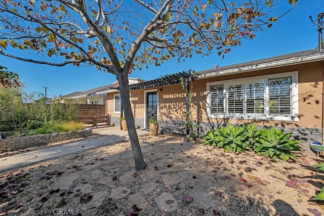 single story home with fence, stucco siding, and a patio