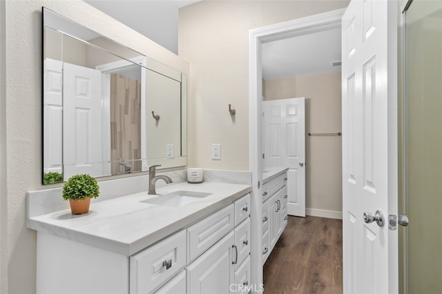 bathroom featuring vanity and wood finished floors