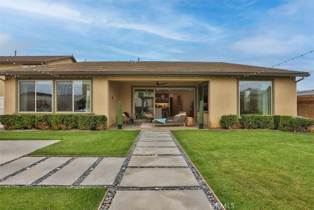 1772 Lundy Ln, Beaumont, CA 92223 - rear view of house featuring stucco siding, a patio, and a yard