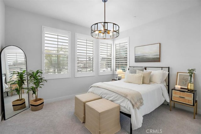 1772 Lundy Ln, Beaumont, CA 92223 - bedroom featuring a chandelier, carpet, multiple windows, and baseboards
