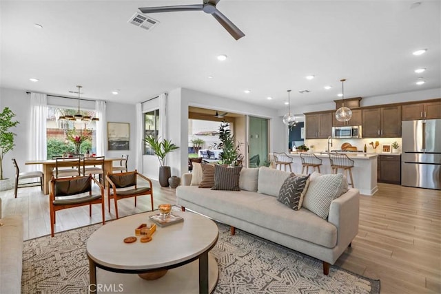 1772 Lundy Ln, Beaumont, CA 92223 - living area featuring light wood-style flooring, a ceiling fan, and recessed lighting