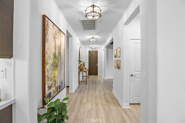 1772 Lundy Ln, Beaumont, CA 92223 - hall featuring light wood-style flooring and baseboards
