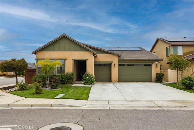 1772 Lundy Ln, Beaumont, CA 92223 - view of front of home with a garage, solar panels, driveway, and stucco siding