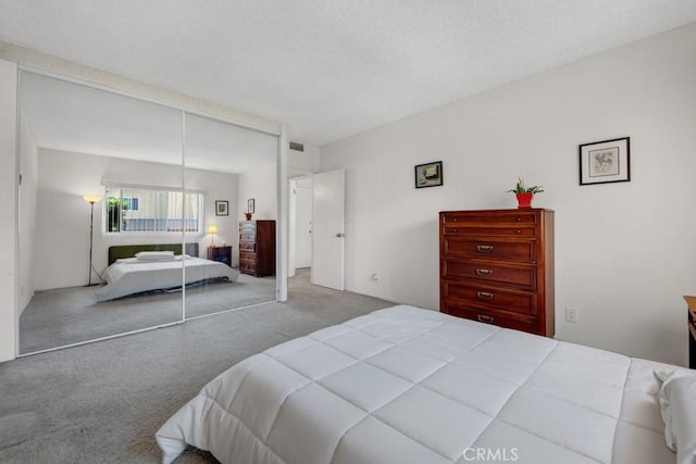 carpeted bedroom featuring a closet