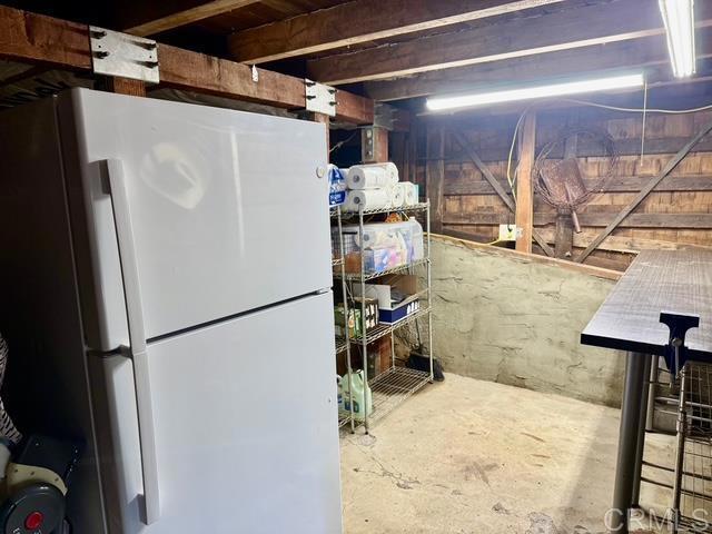 22104 Crestline, Palomar Mountain, CA 92060 - unfinished basement featuring freestanding refrigerator