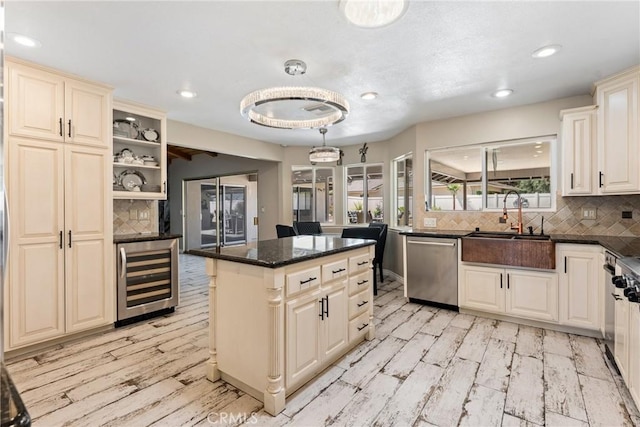 618 E Sunset Dr N, Redlands, CA 92373 - kitchen with wine cooler, stainless steel dishwasher, a kitchen island, decorative backsplash, and recessed lighting